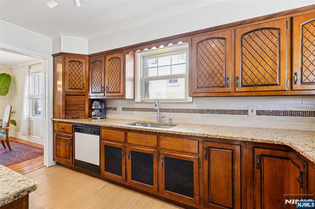53 Forest Hill Road West Orange, NJ 07052 - Photo 16 of 40 a kitchen with stainless steel appliances granite countertop a sink and a stove