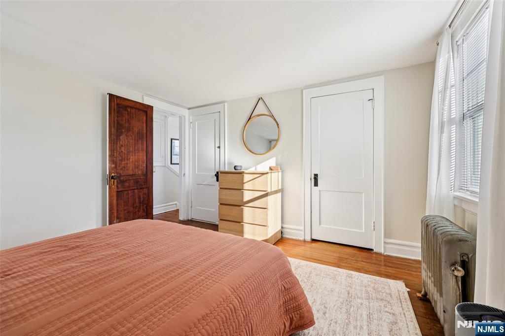 53 Forest Hill Road West Orange, NJ 07052 - Photo 23 of 40 a bedroom with a bed and a cabinets