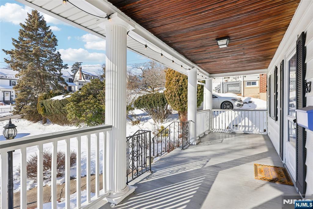 53 Forest Hill Road West Orange, NJ 07052 - Photo 5 of 40 a view of a porch with wooden floor of the house