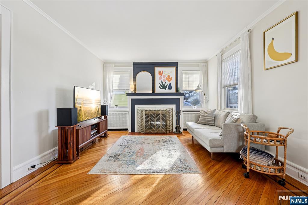 53 Forest Hill Road West Orange, NJ 07052 - Photo 7 of 40 a living room with furniture and a fireplace