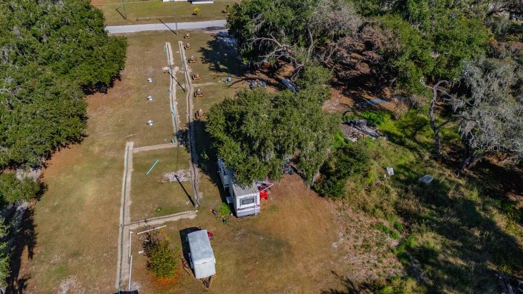 415 Hal Colding Road Lithia, FL 33547 - Photo 23 of 73 an aerial view of residential house with outdoor space and trees all around