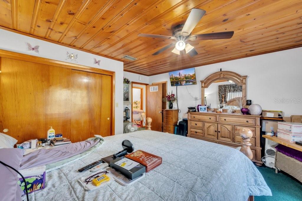 415 Hal Colding Road Lithia, FL 33547 - Photo 29 of 73 a bed room with a bed and a dresser