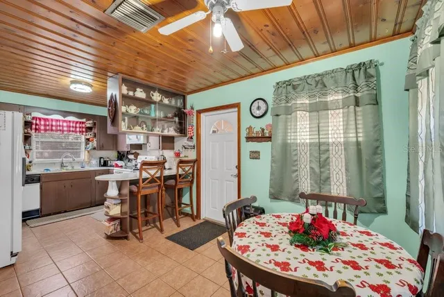 a view of a livingroom with furniture and a window