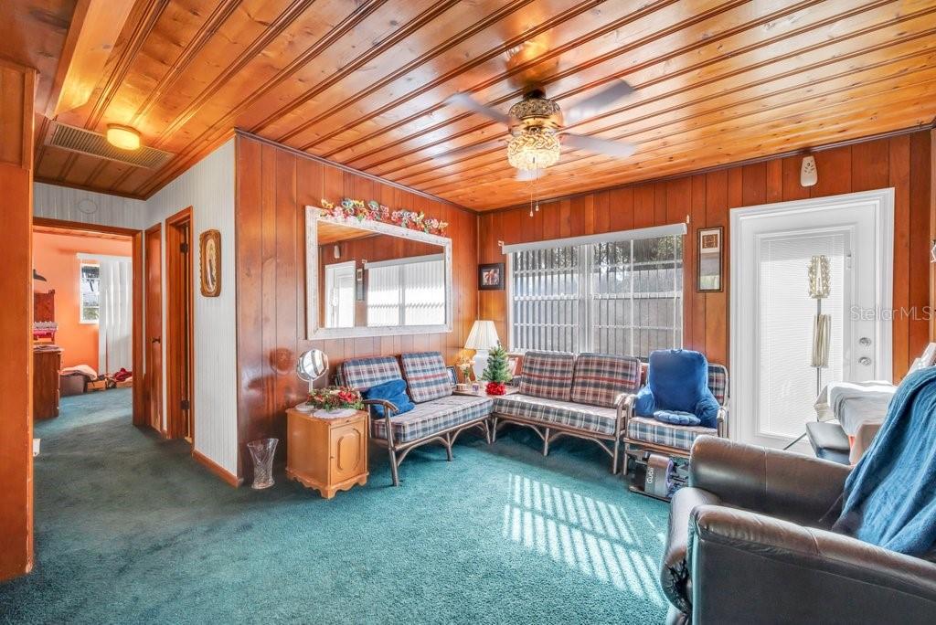 415 Hal Colding Road Lithia, FL 33547 - Photo 40 of 73 a living room with furniture and a chandelier