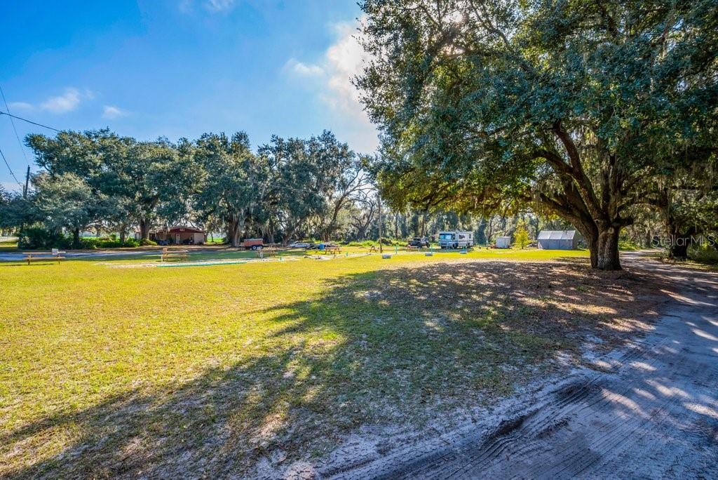 415 Hal Colding Road Lithia, FL 33547 - Photo 47 of 73 a view of an swimming pool with an outdoor space and seating area