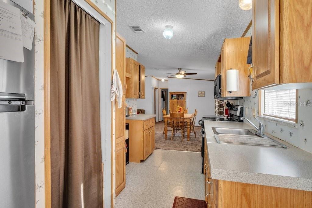 415 Hal Colding Road Lithia, FL 33547 - Photo 65 of 73 a view of a kitchen with furniture and a window