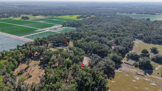 a aerial view of a house with a yard