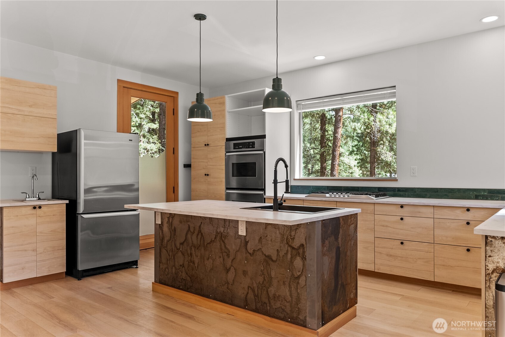 78 Homestead Road Winthrop, WA 98862 - Photo 12 of 40 a kitchen with stainless steel appliances granite countertop a sink window and refrigerator