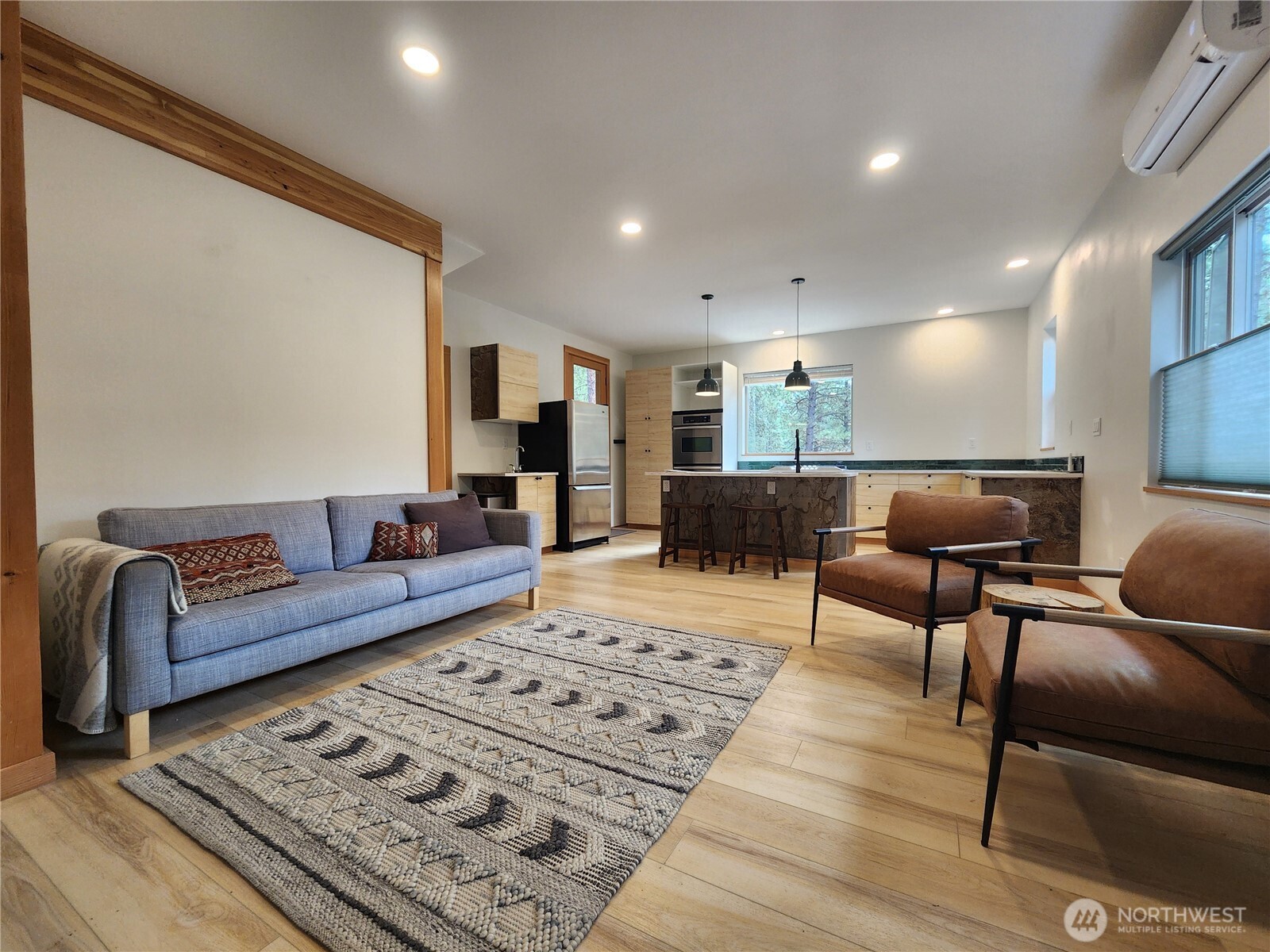 78 Homestead Road Winthrop, WA 98862 - Photo 2 of 40 a living room with furniture and a rug