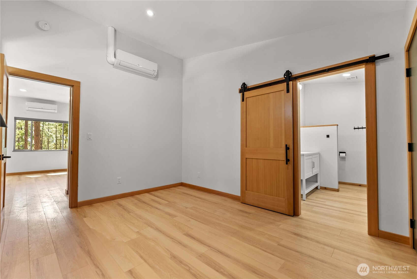 78 Homestead Road Winthrop, WA 98862 - Photo 21 of 40 wooden floor in an empty room with a window