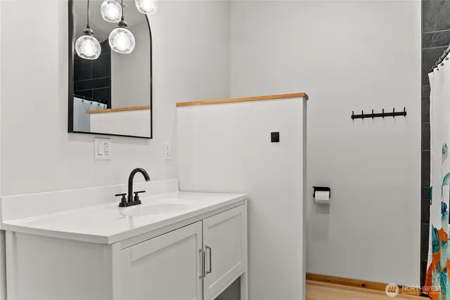a en suite bathroom with a sink and mirror