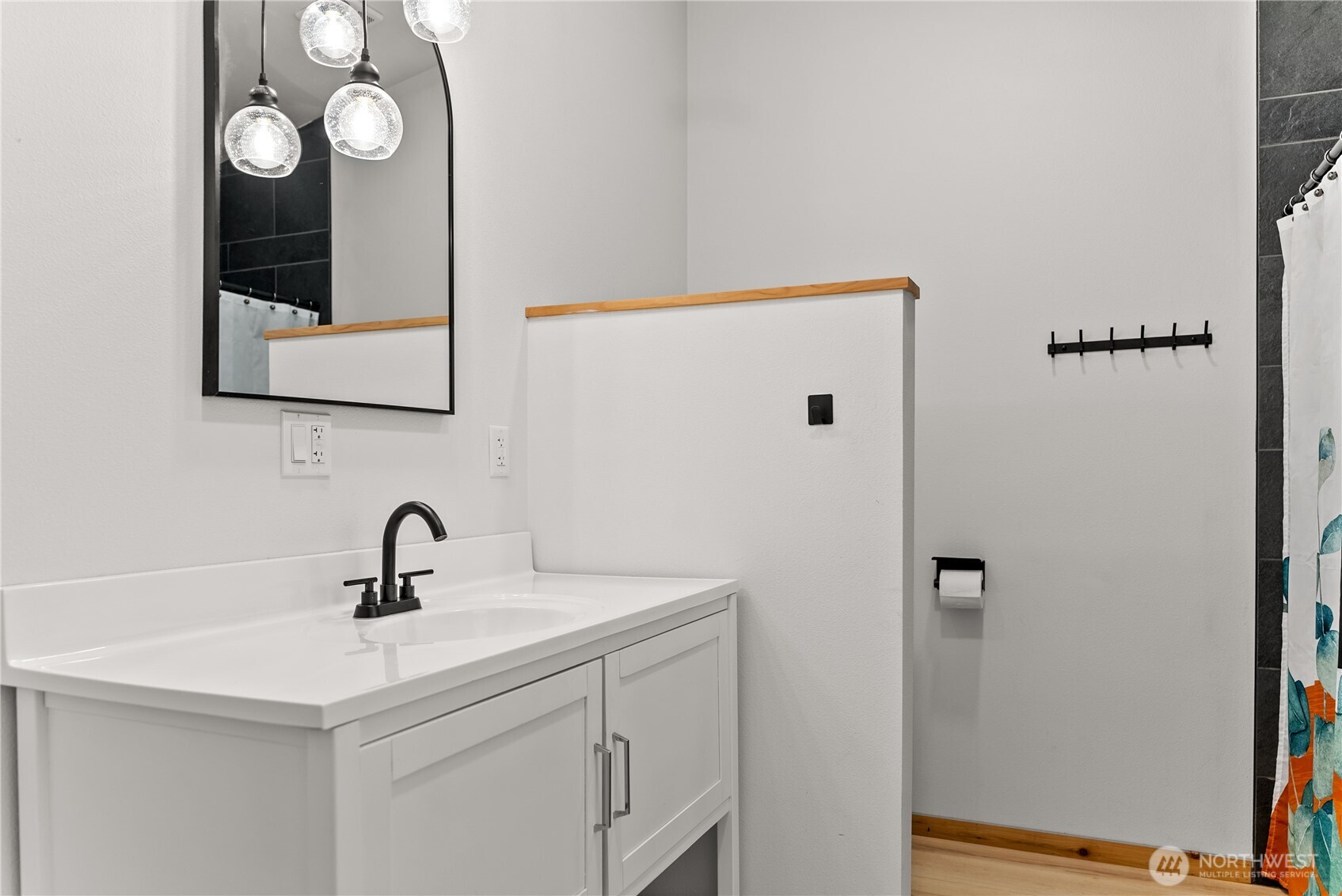 78 Homestead Road Winthrop, WA 98862 - Photo 24 of 40 a bathroom with a sink and a mirror