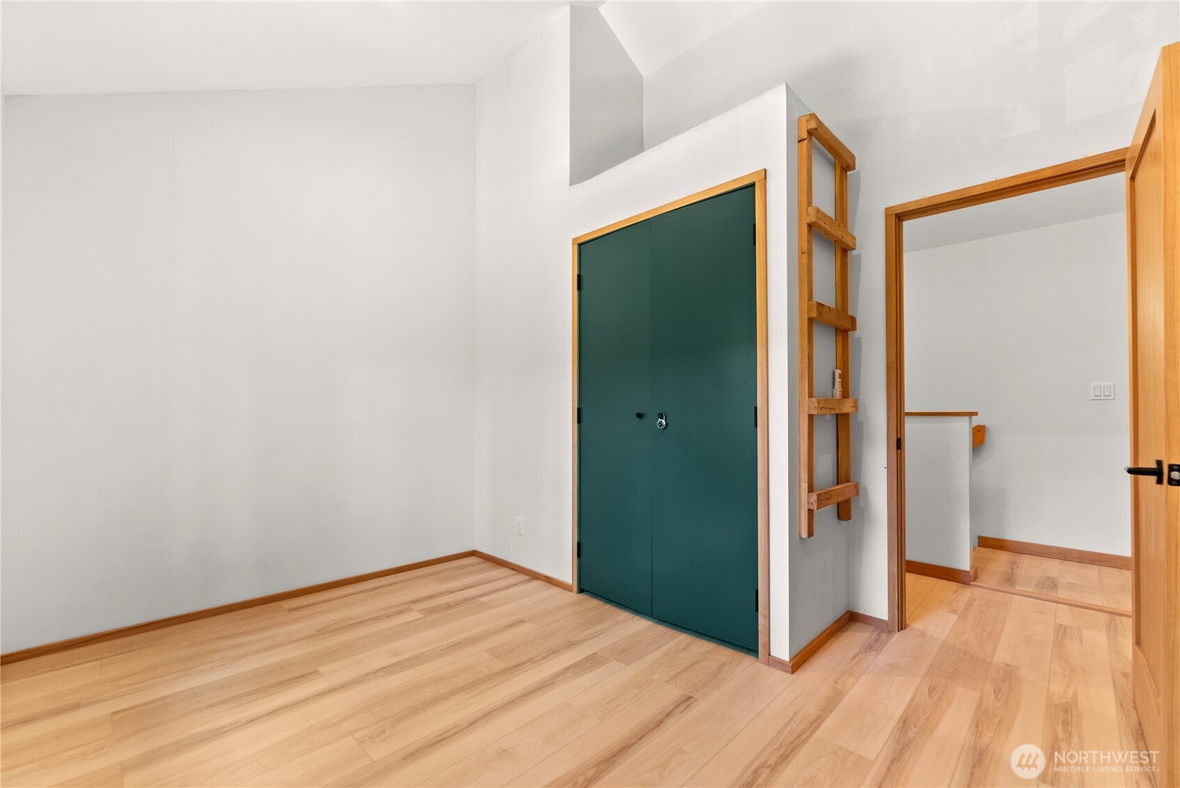 78 Homestead Road Winthrop, WA 98862 - Photo 30 of 40 a view of empty room with wooden floor and entryway