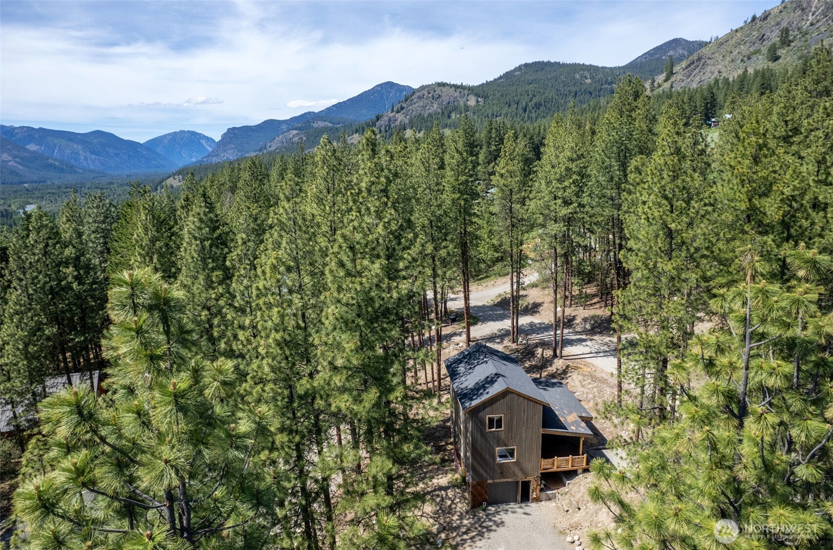 78 Homestead Road Winthrop, WA 98862 - Photo 36 of 40 an aerial view of a house with a mountain