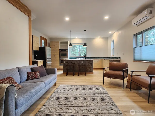 a living room with furniture and a rug