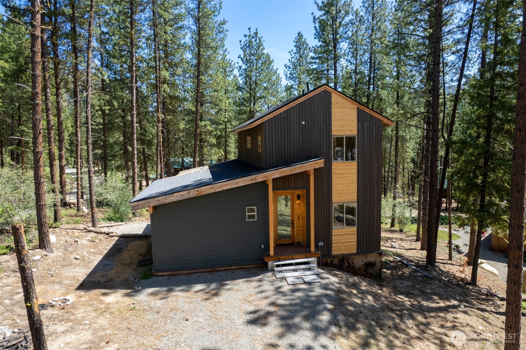 78 Homestead Road Winthrop, WA 98862 - Photo 10 of 40 a view of a house with a tree in the background