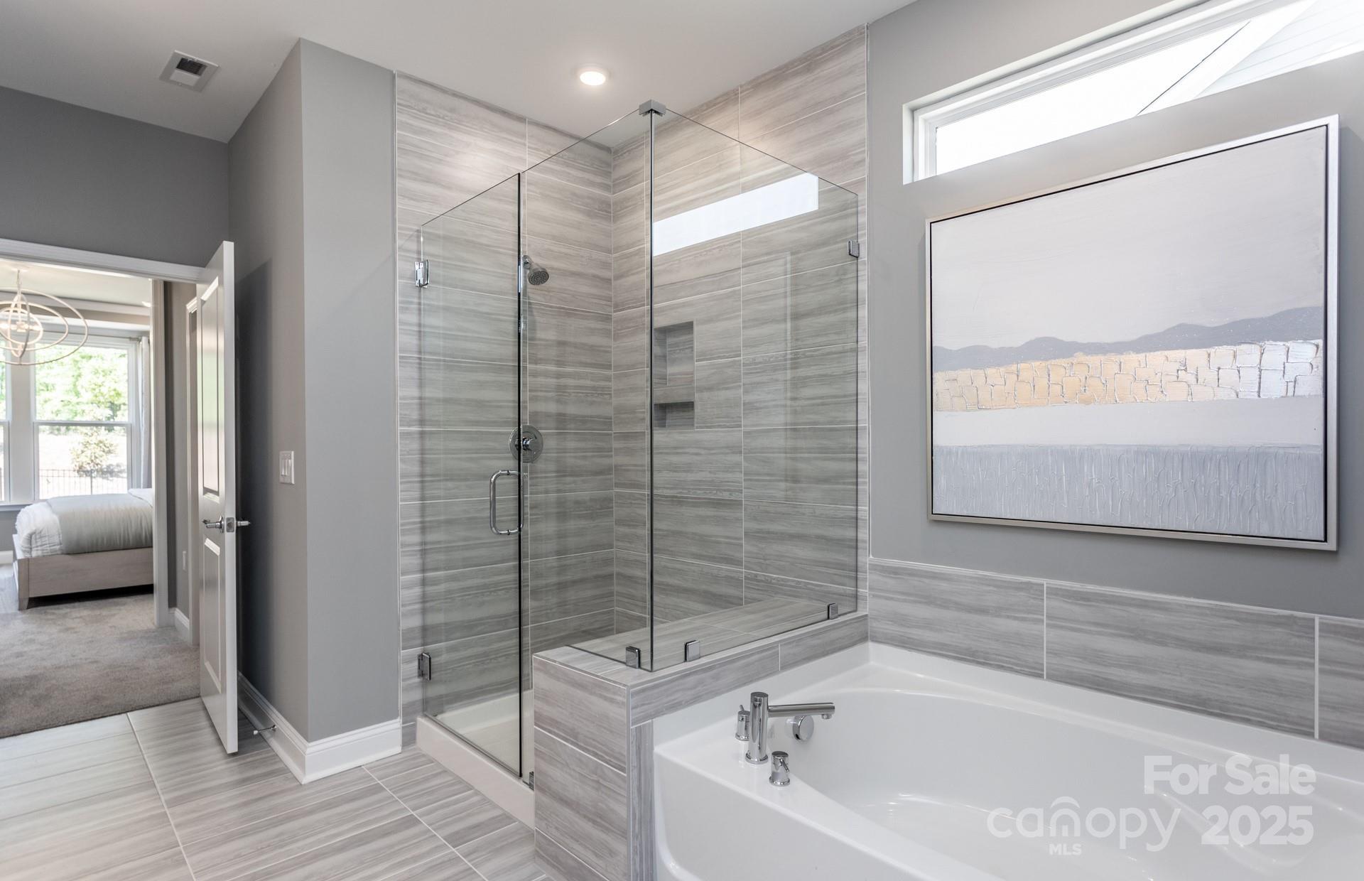 4796 Formation Court, Unit 68 Lancaster, SC 29720 - Photo 12 of 17 a bathroom with a bathtub and a shower