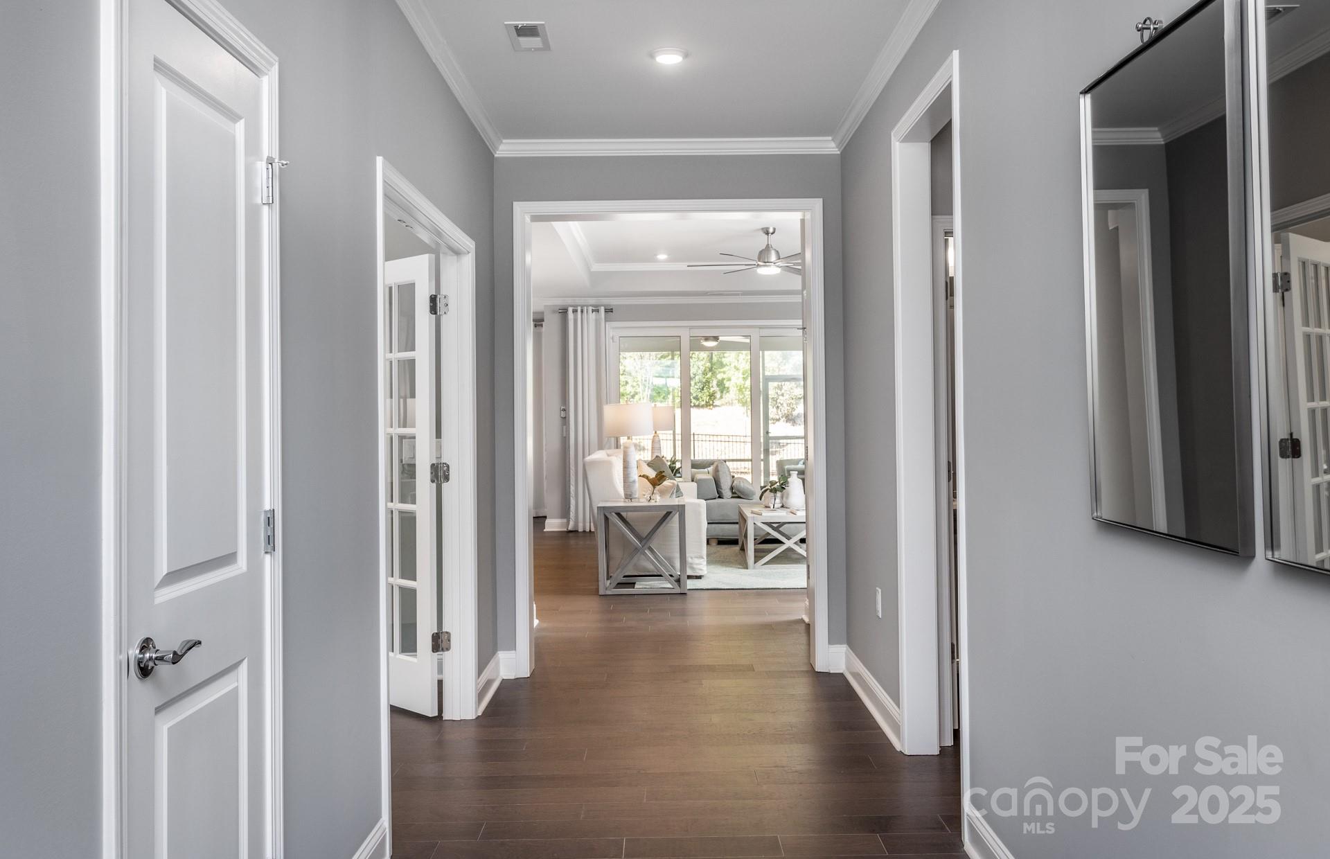 4796 Formation Court, Unit 68 Lancaster, SC 29720 - Photo 16 of 17 a view of a hallway with wooden floor windows and a livingroom