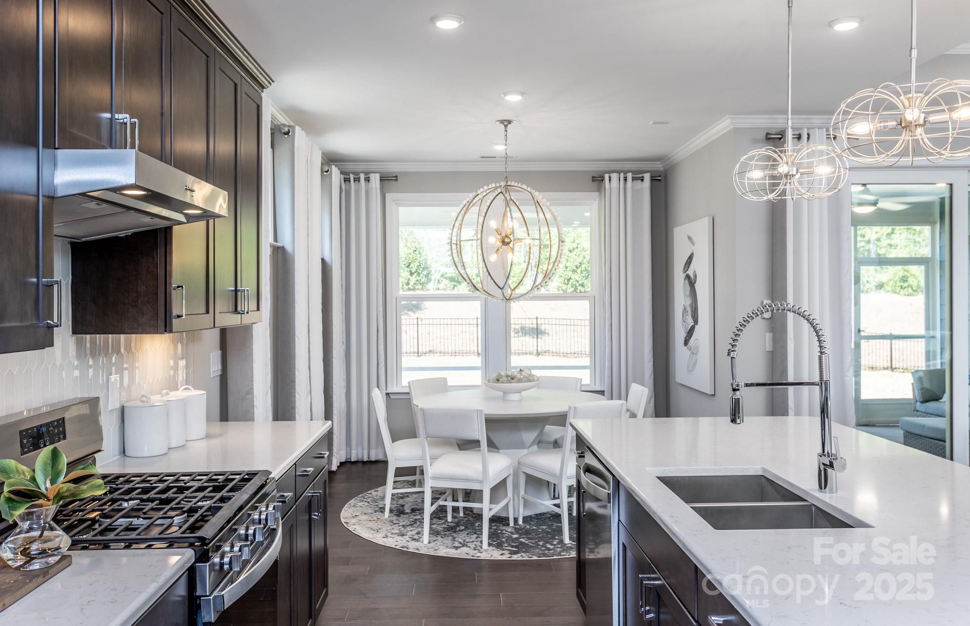 4796 Formation Court, Unit 68 Lancaster, SC 29720 - Photo 7 of 17 a kitchen with stainless steel appliances granite countertop a sink stove and cabinets