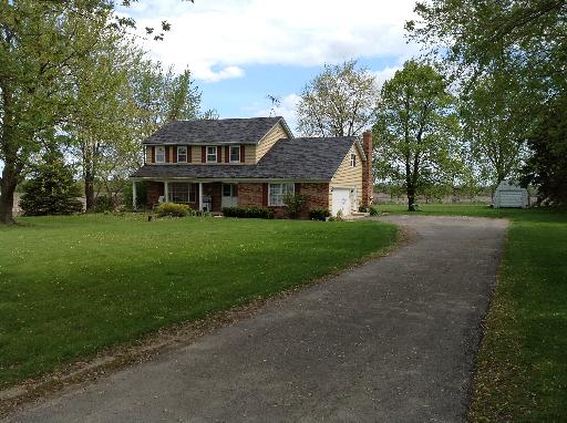1N679 Harley Road Elburn, IL 60119 - Photo 1 of 16 a view of a big house with a big yard and large trees