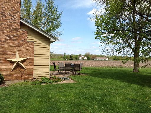 1N679 Harley Road Elburn, IL 60119 - Photo 14 of 16 a view of a backyard with table and chairs and a large tree
