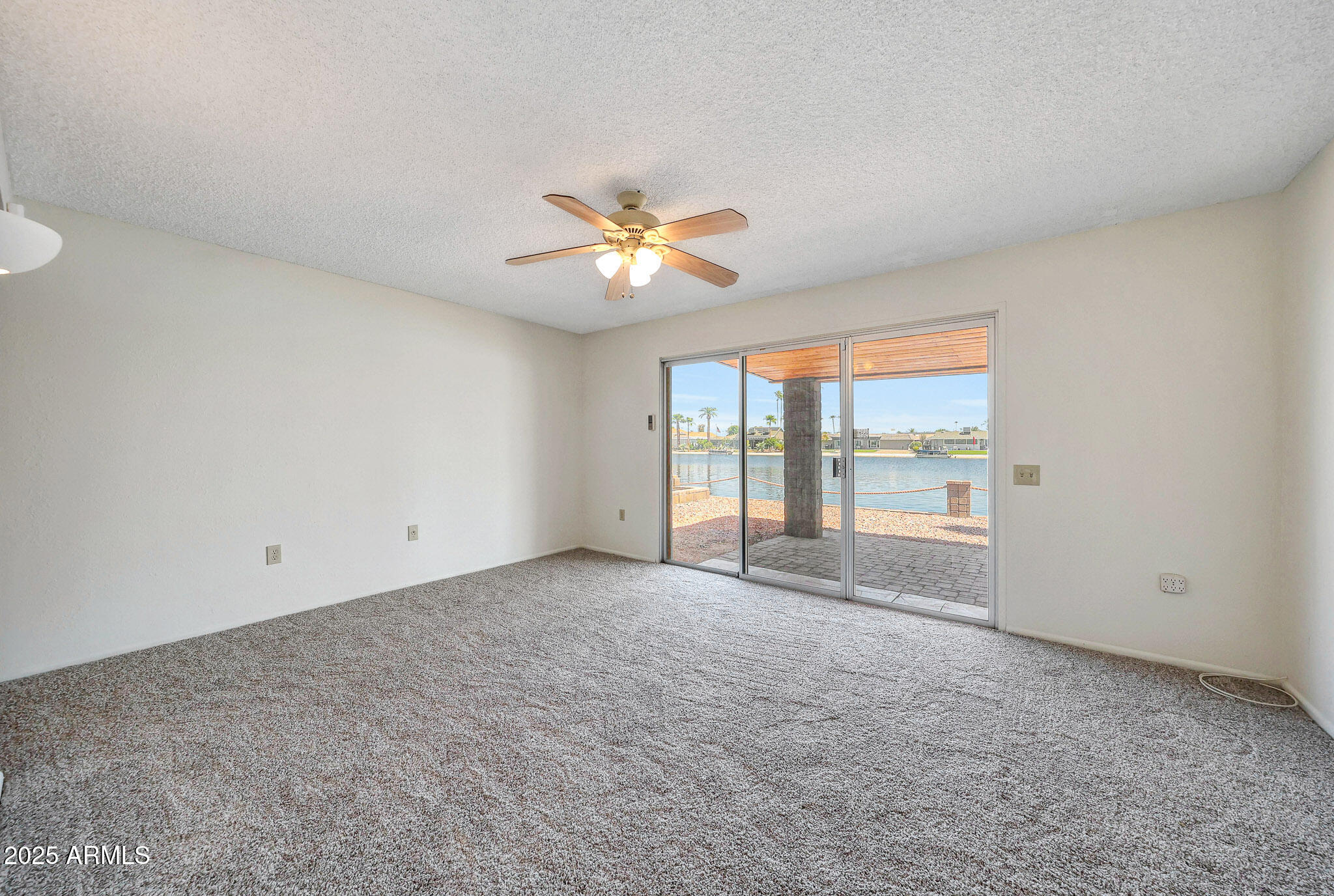 10614 West Emerald Point Sun City, AZ 85351 - Photo 21 of 47 Primary Bedroom w/Lake View