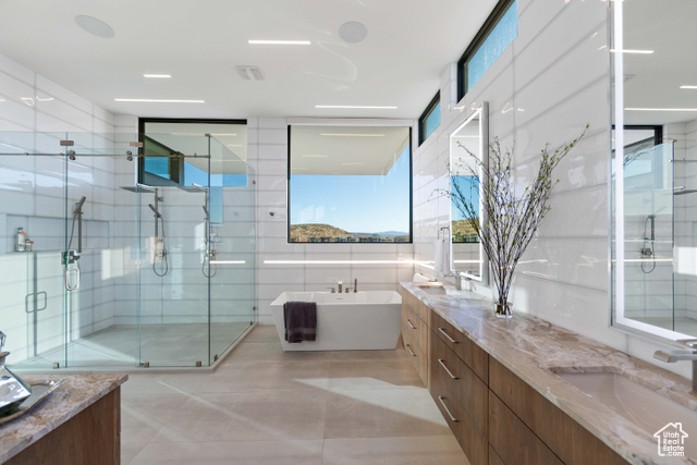 3558 South Cypress Road Hurricane, UT 84737 - Photo 22 of 57 Bathroom featuring walk in shower, a healthy amount of sunlight, and dual vanity