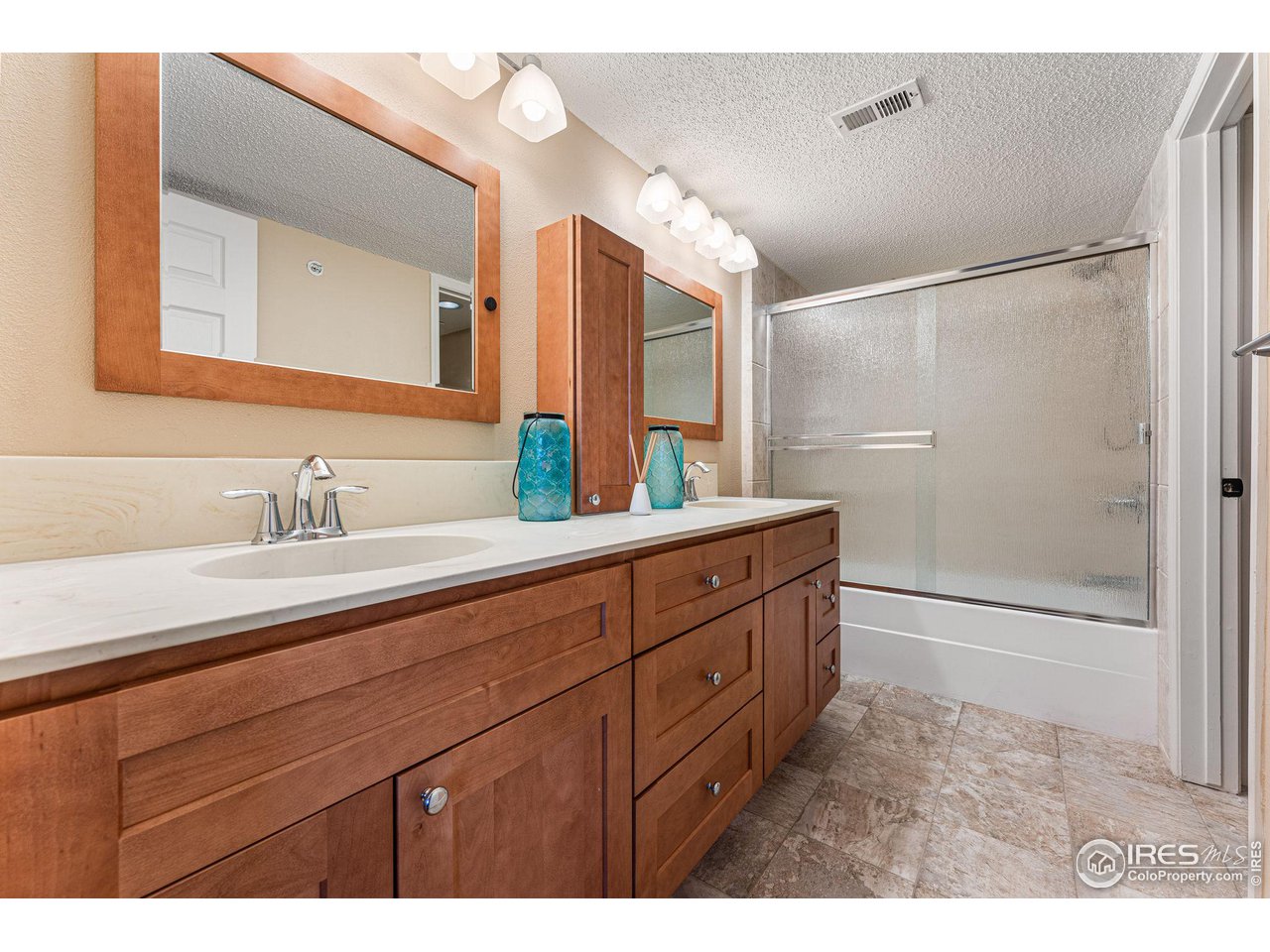 1839 Spaulding Circle Superior, CO 80027 - Photo 13 of 27 a bathroom with a granite countertop sink mirror and double