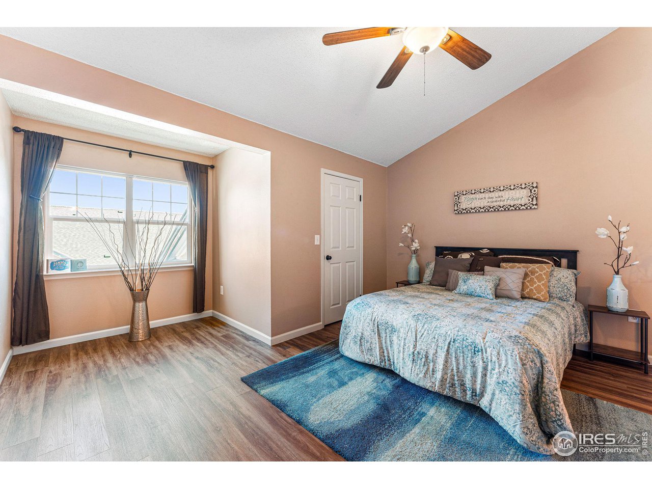 1839 Spaulding Circle Superior, CO 80027 - Photo 14 of 27 a bedroom with a bed and wooden floor
