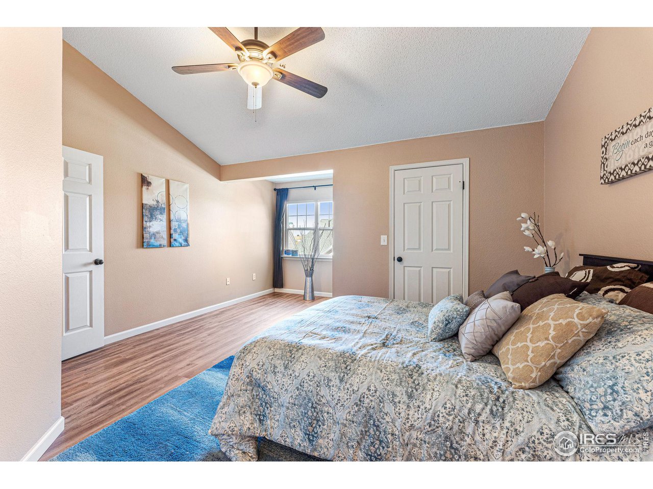 1839 Spaulding Circle Superior, CO 80027 - Photo 16 of 27 a bedroom with a bed ceiling fan and wooden floor