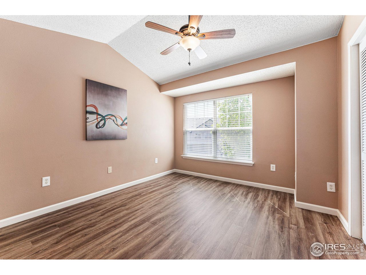1839 Spaulding Circle Superior, CO 80027 - Photo 18 of 27 wooden floor in an empty room with a window