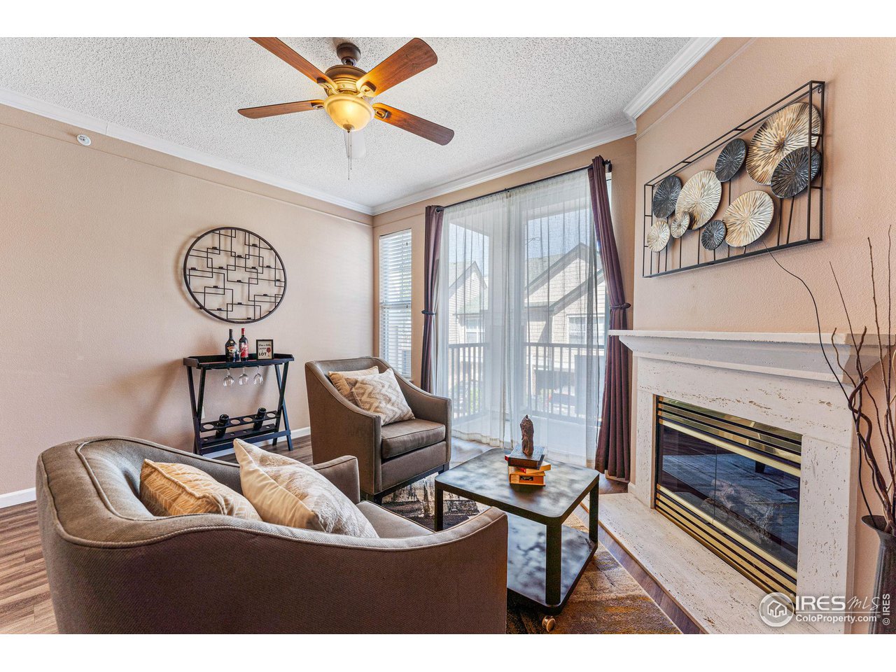 1839 Spaulding Circle Superior, CO 80027 - Photo 2 of 27 a living room with furniture a fireplace and a large window
