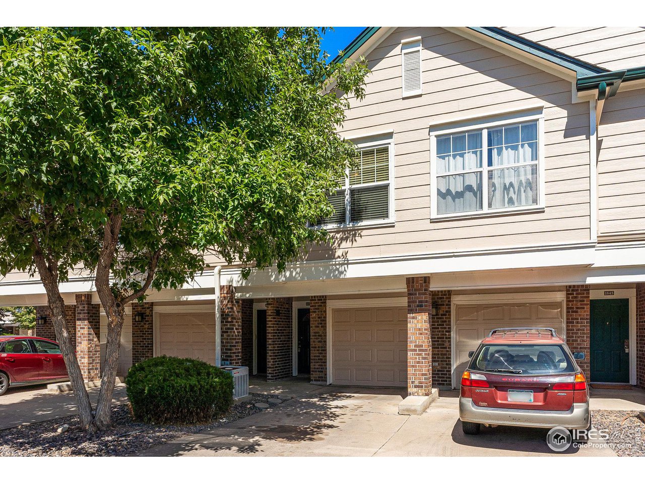 1839 Spaulding Circle Superior, CO 80027 - Photo 24 of 27 a car parked in front of white house