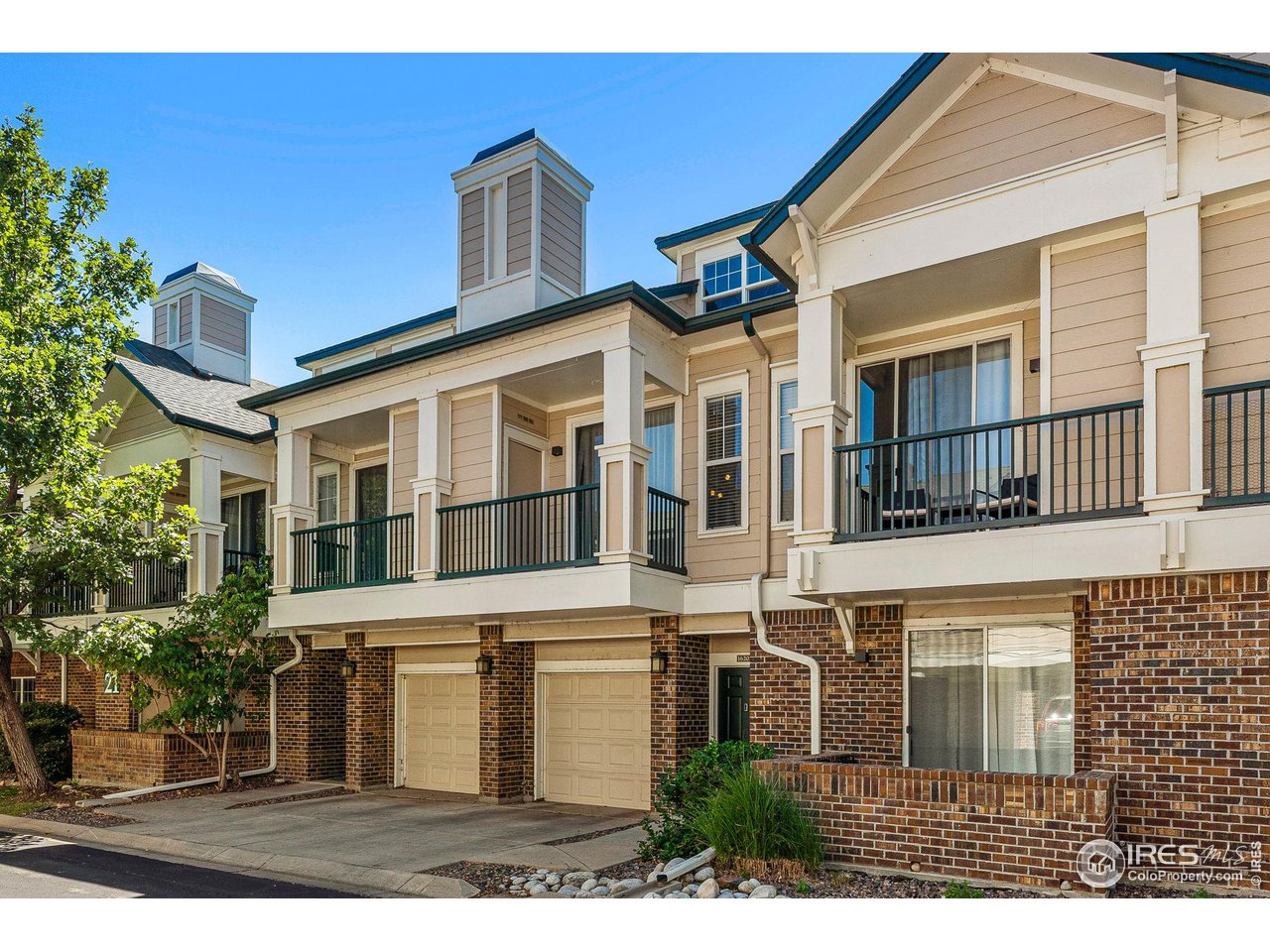 1839 Spaulding Circle Superior, CO 80027 - Photo 26 of 27 a front view of a house with a yard