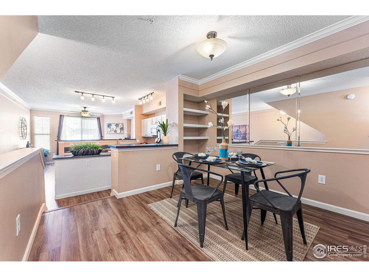 1839 Spaulding Circle Superior, CO 80027 - Photo 9 of 27 a dining area with a table chairs and a kitchen view
