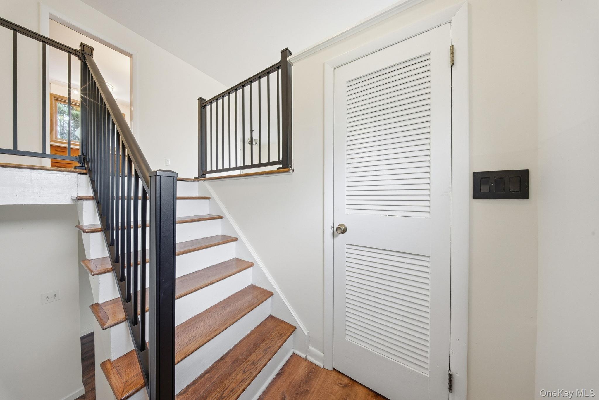 87 Airport Road Eldred, NY 12732 - Photo 6 of 30 a view of a hallway with wooden floor and windows