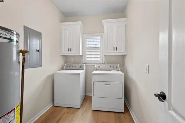 a view of a storage & utility room with closet dryer