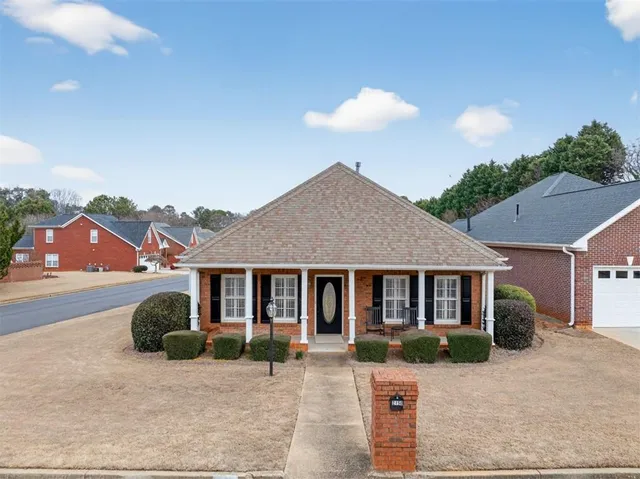 a front view of a house with yard