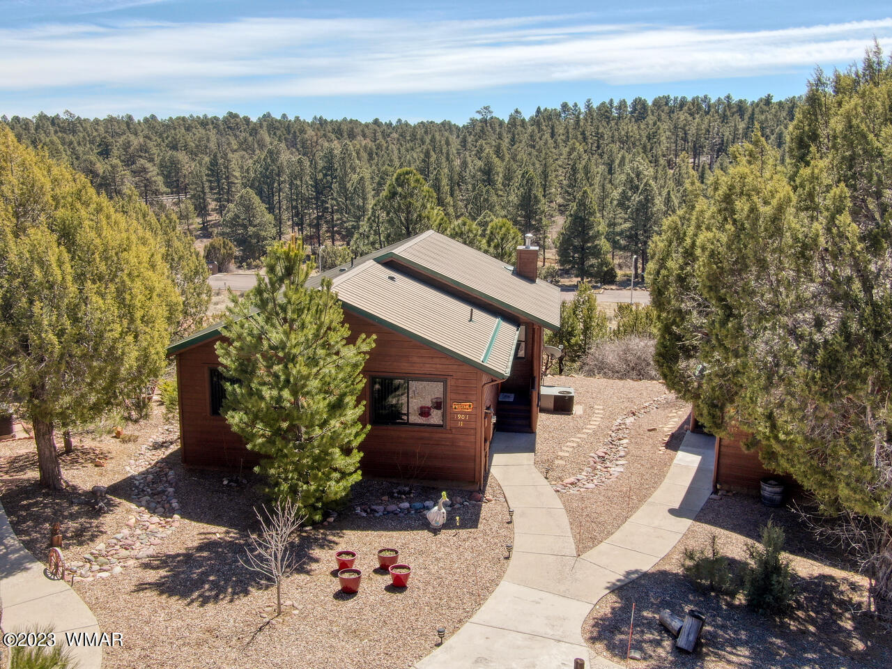 1911 North Bison Ridge Trail, Unit 10 Show Low, AZ 85901 - Photo 1 of 17 a view of a terrace with a bench