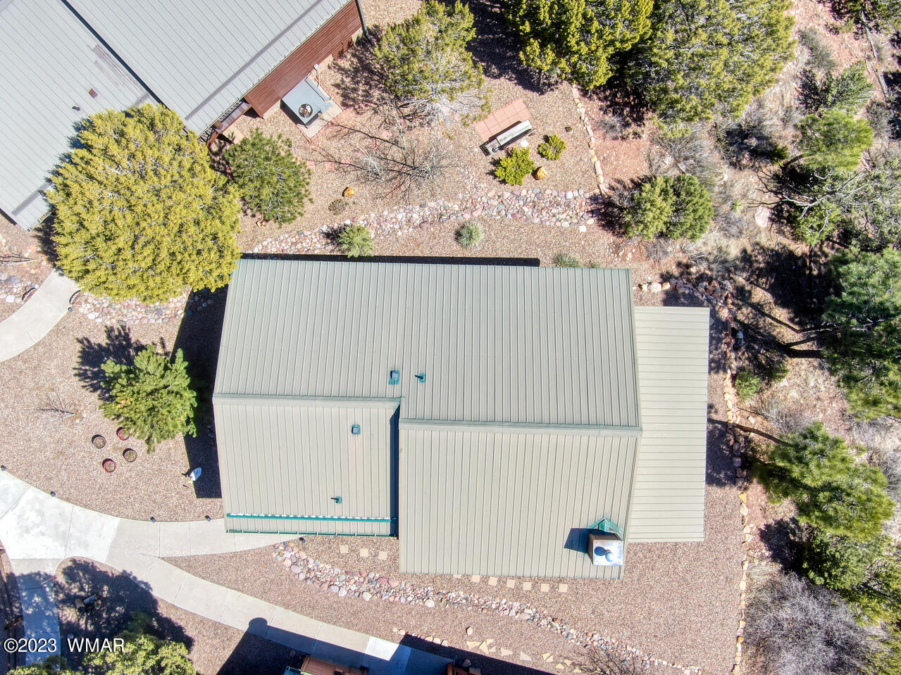 1911 North Bison Ridge Trail, Unit 10 Show Low, AZ 85901 - Photo 16 of 17 a view of a house with a potted plant