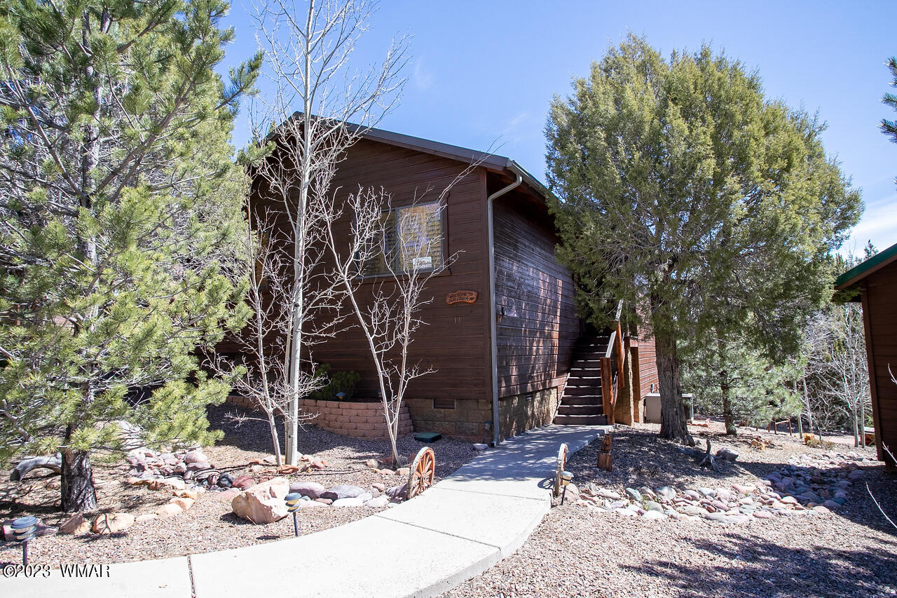 1911 North Bison Ridge Trail, Unit 10 Show Low, AZ 85901 - Photo 2 of 17 a view of a house with a tree