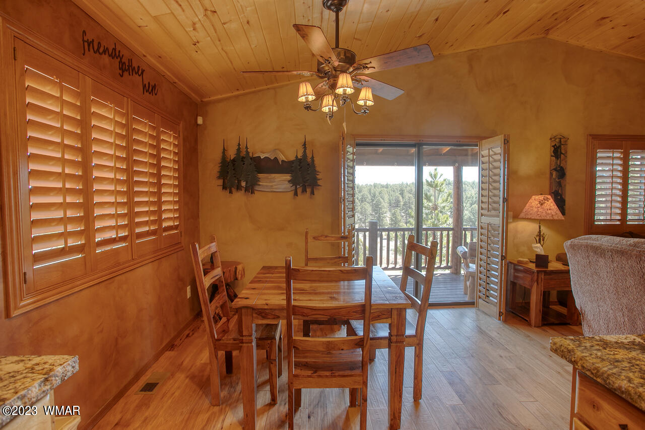 1911 North Bison Ridge Trail, Unit 10 Show Low, AZ 85901 - Photo 8 of 17 a view of a dining room with furniture window and outside view