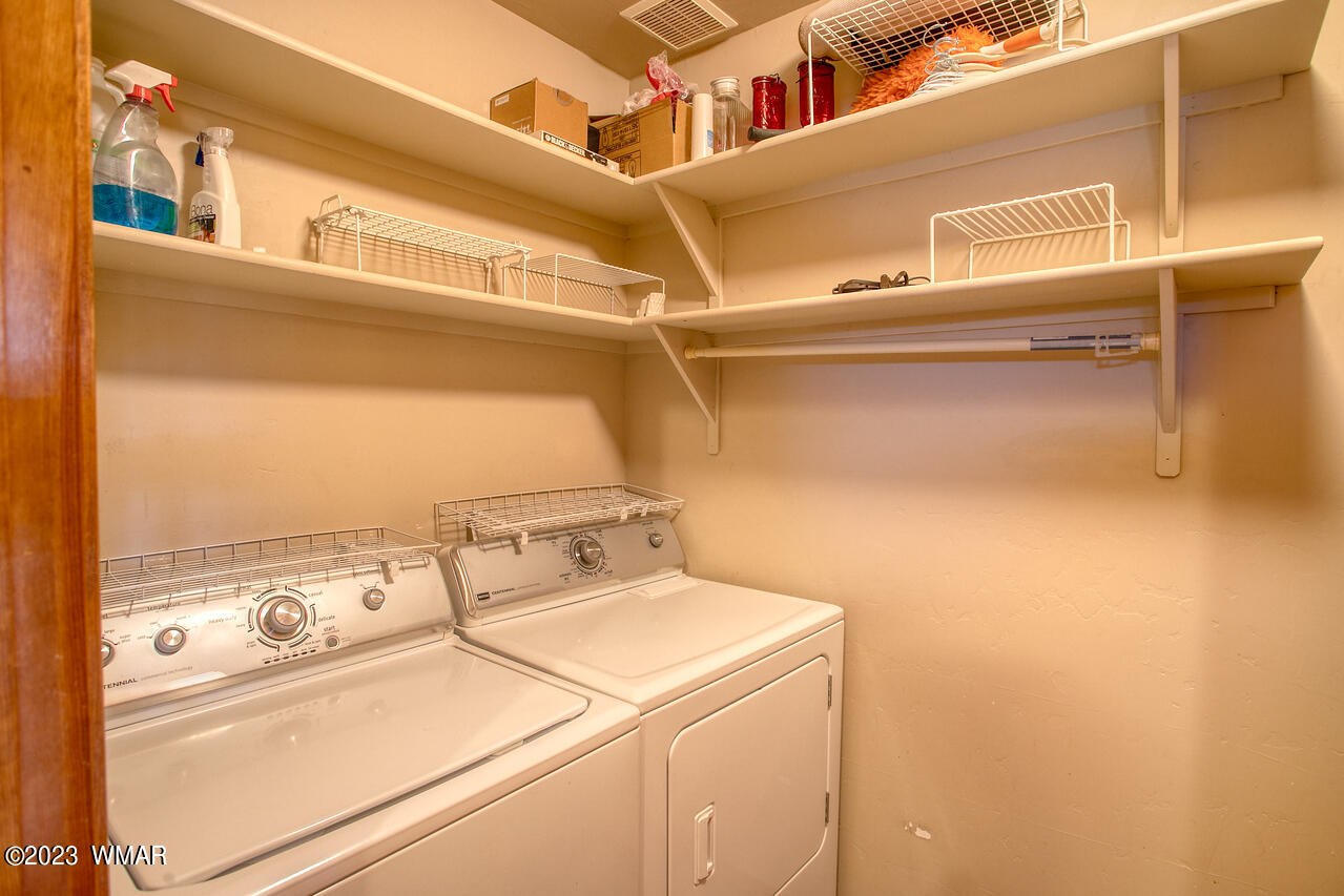 1911 North Bison Ridge Trail, Unit 10 Show Low, AZ 85901 - Photo 9 of 17 a utility room with dryer and washer