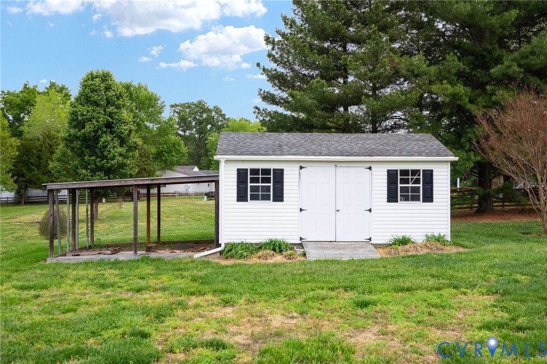 16379 Arch Hill Road Hanover, VA 23069 - Photo 23 of 26 a front view of house with yard and green space
