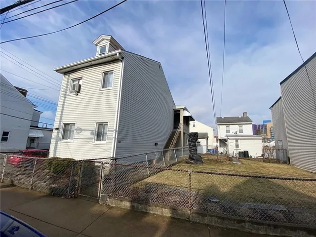 a view of a house with a street