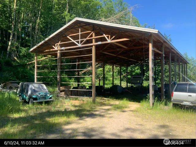 a view of a house with backyard porch and sitting area