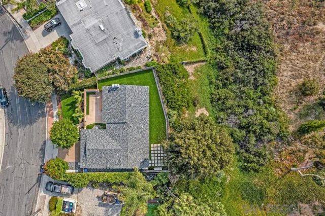 an aerial view of a house with a garden