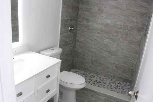 a bathroom with a bathtub and shower