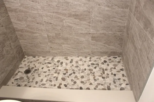 a view of a house with a wooden fence