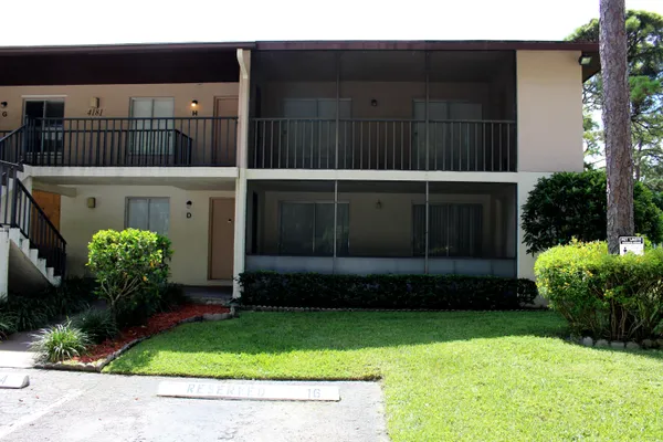 a view of a house with a garden